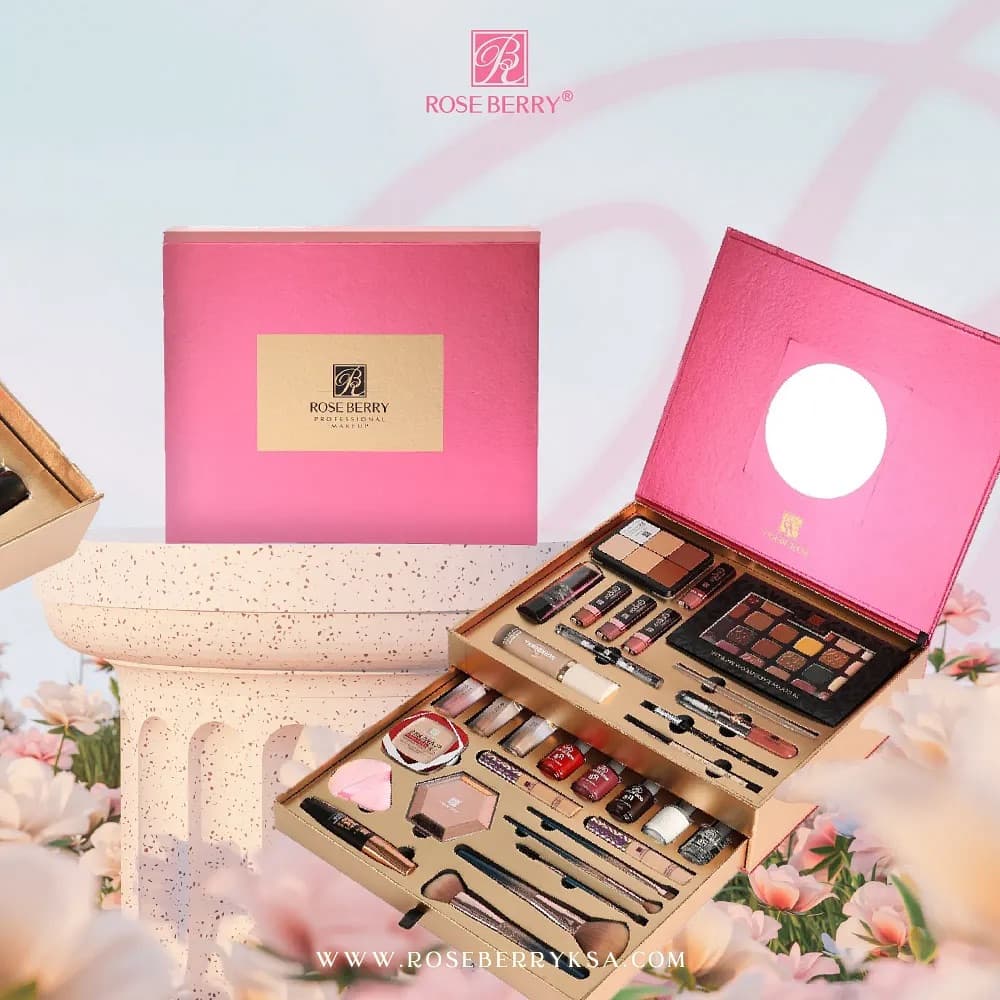 Rose Berry gift set — an open pink makeup box with mirror, styled among blossom