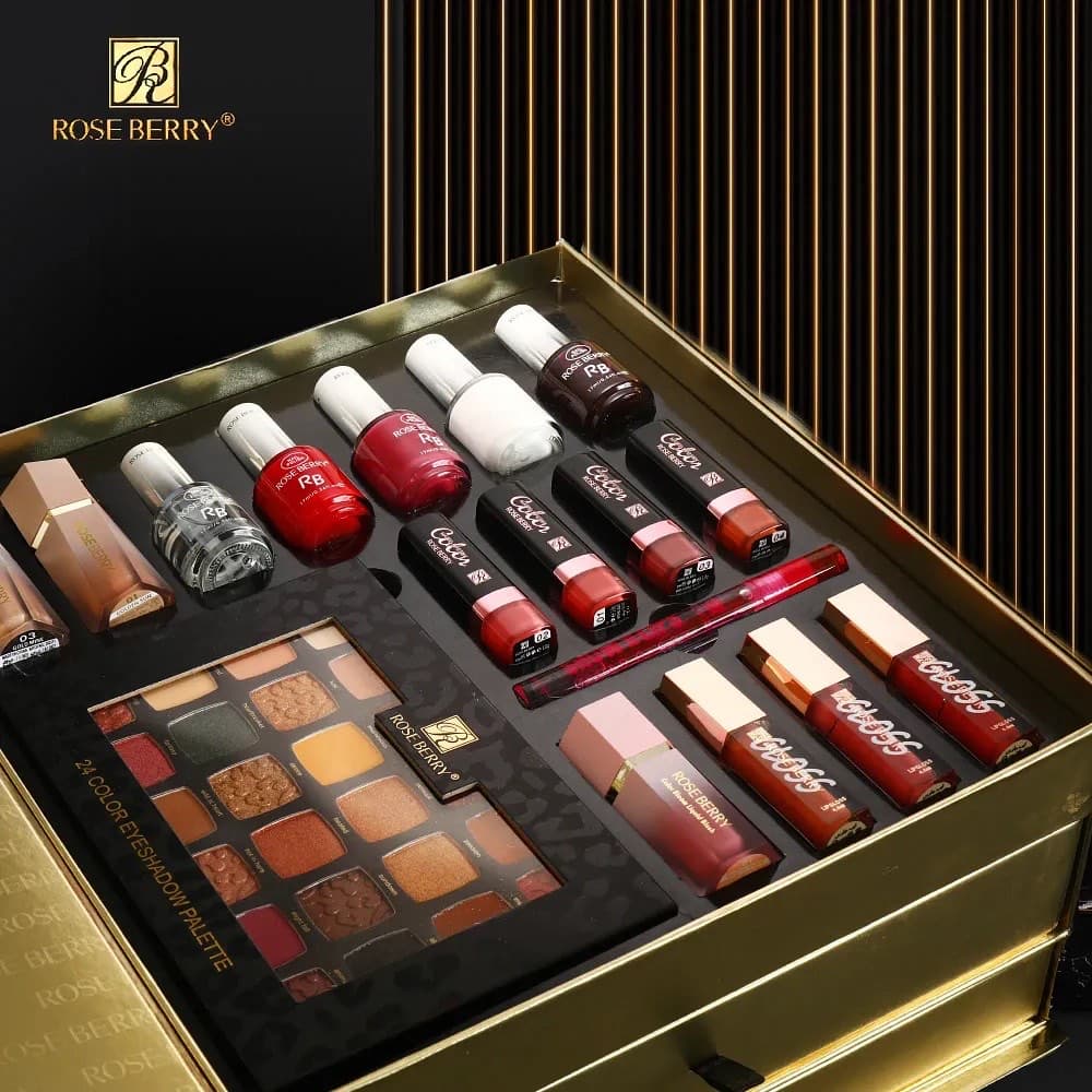The Rose Berry Golden Box — an open makeup case shot against dark gold fluting